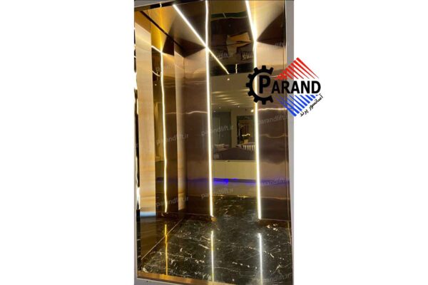 کابین آسانسور طلایی دودی با نورپردازی طرح بهدیس